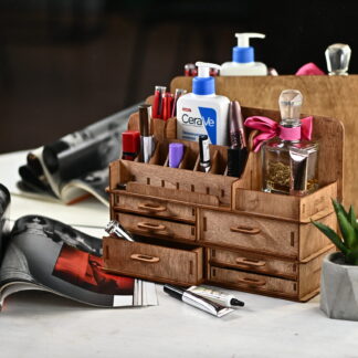 A close-up shot of a hand placing a lipstick into one of the compartments.