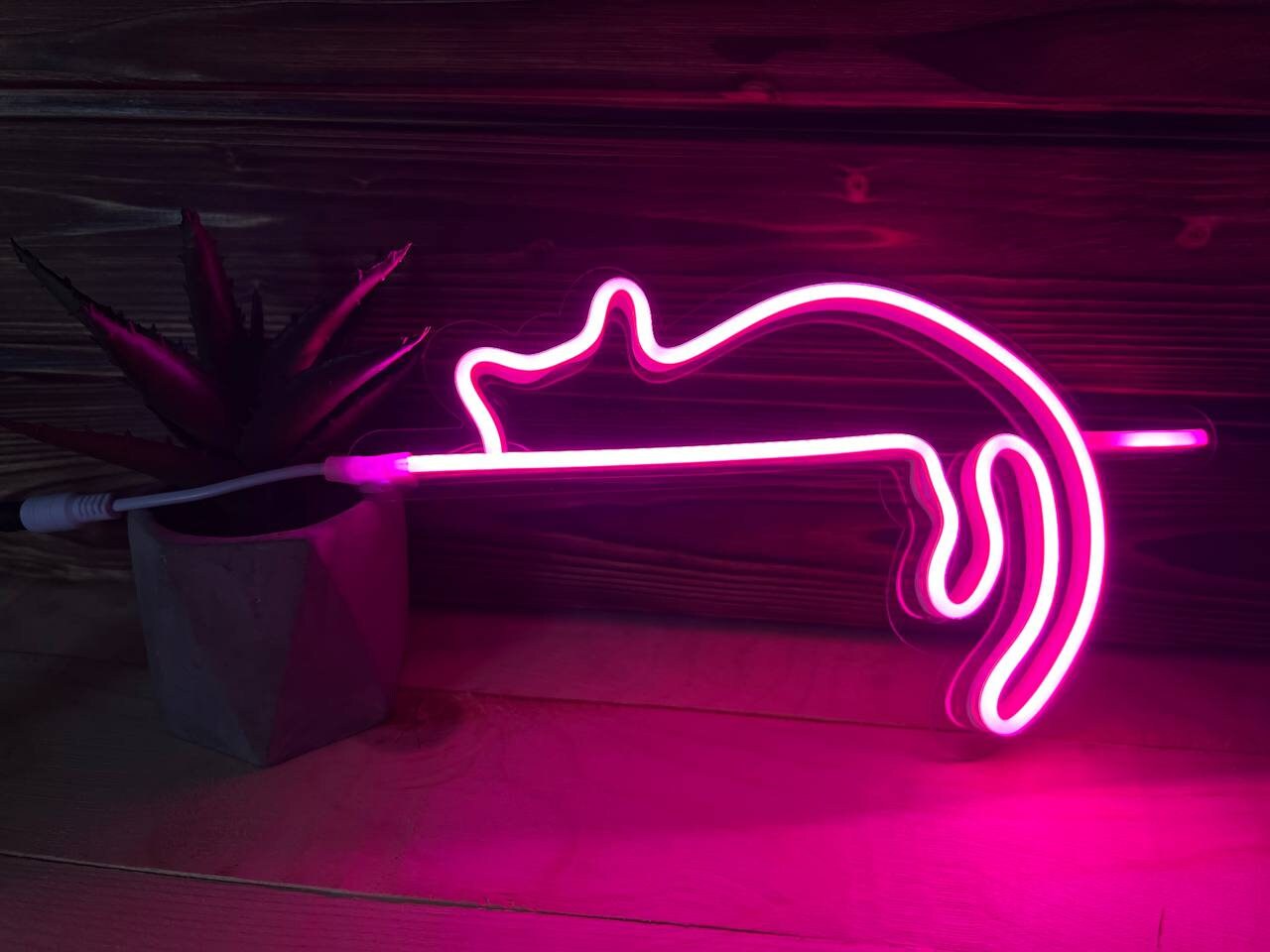 The nightlight placed on a desktop, with the soft light creating a cozy ambiance.