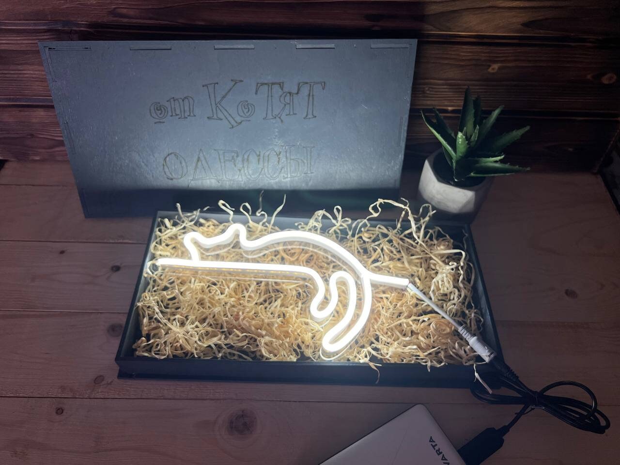 A close-up shot of the USB LED nightlight plugged into a laptop, illuminating the keyboard.