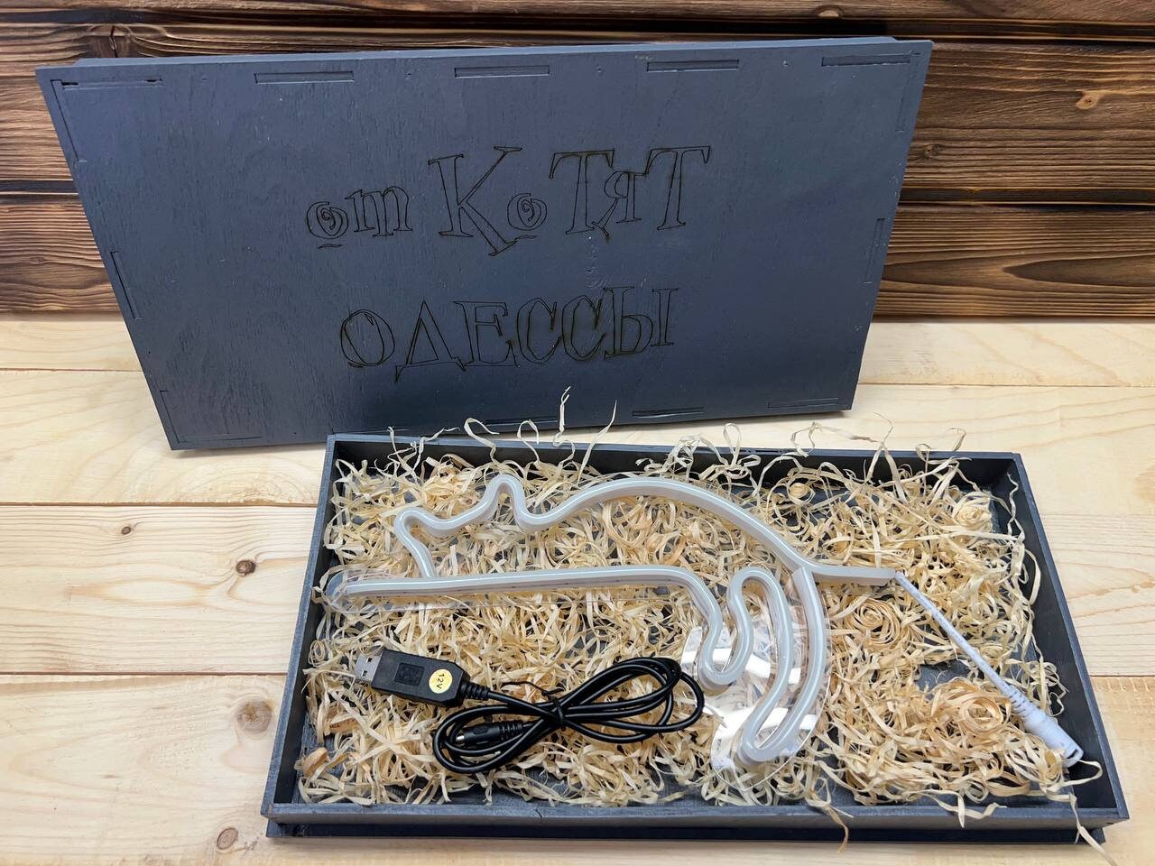 The nightlight shown plugged into a power bank in a dark room.