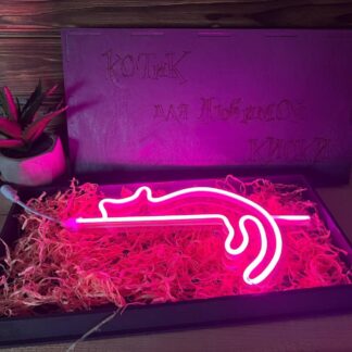 A photo of the nightlight in a hand, emphasizing its portability.