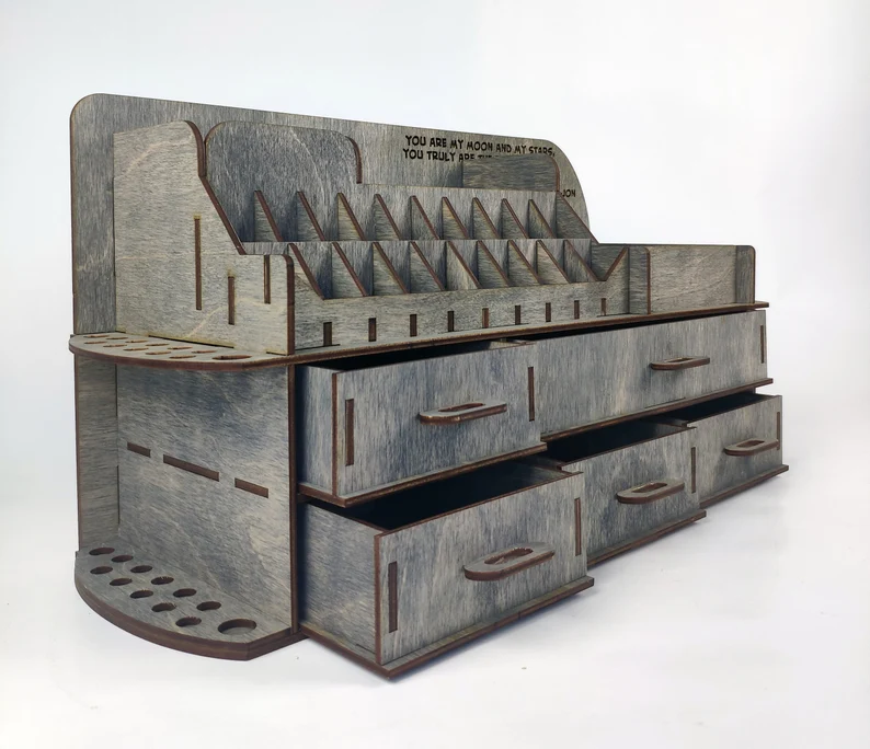 A top-down view of all the flat, laser-cut wooden pieces of the 