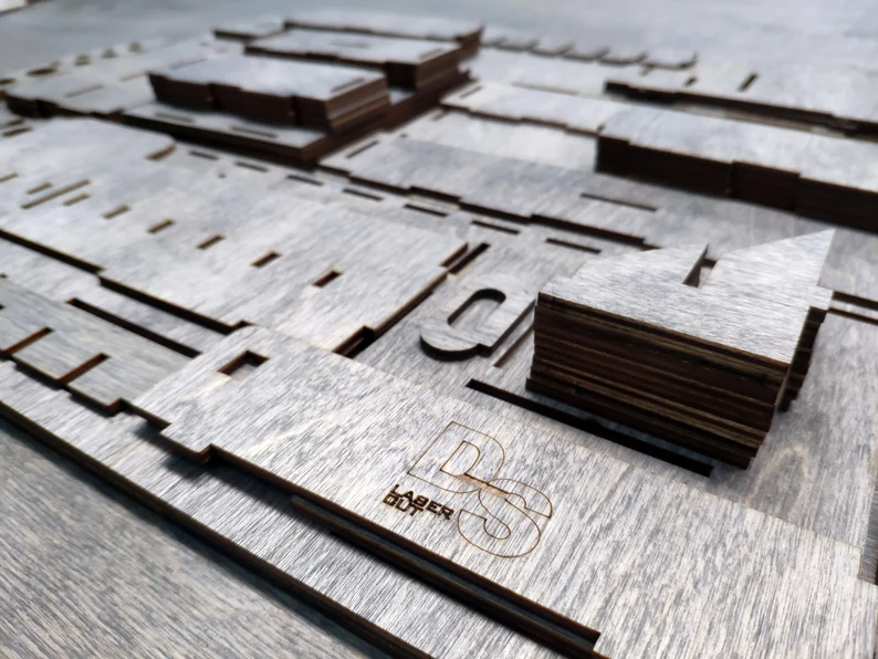 A close-up shot of the intricate joinery and details on a few of the wooden pieces, highlighting the precision of the cuts.