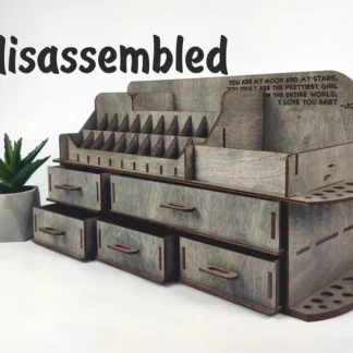 A photo showing a hand picking up one of the wooden pieces, ready for assembly.