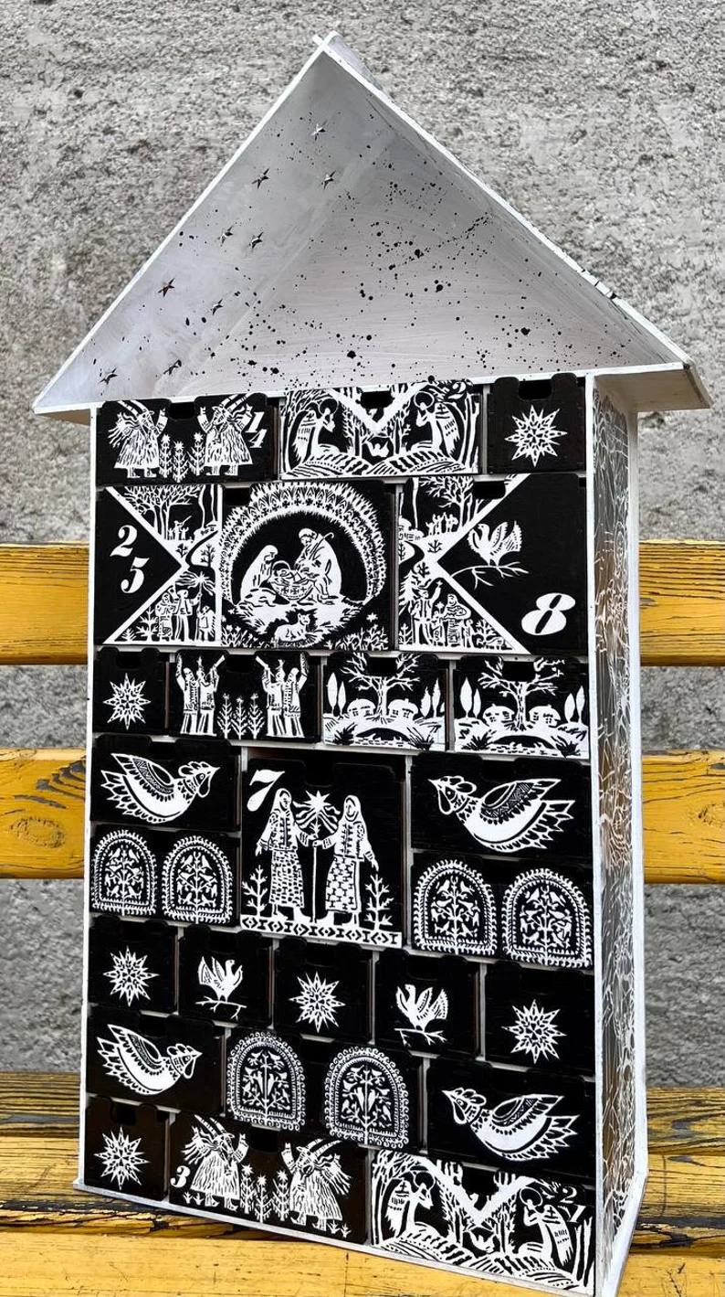 A close-up of a small decorative item placed in one of the compartments.