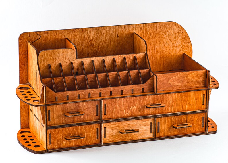 A lifestyle photo of the organizer on a clean, light-colored vanity, with a mirror and other decorative items in the background.