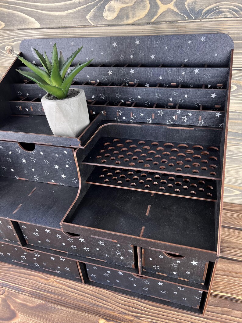 The organizer placed on a dresser, with a mirror and other accessories.