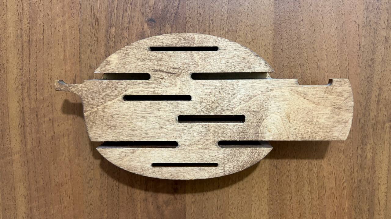 A wider shot of the key holder on a wall in a modern, minimalistic room, demonstrating how it fits into the overall interior design.