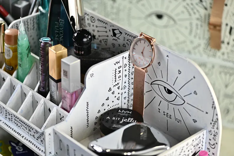 A top-down view of the organizer, showcasing its full layout and the thoughtful arrangement of cosmetics within.