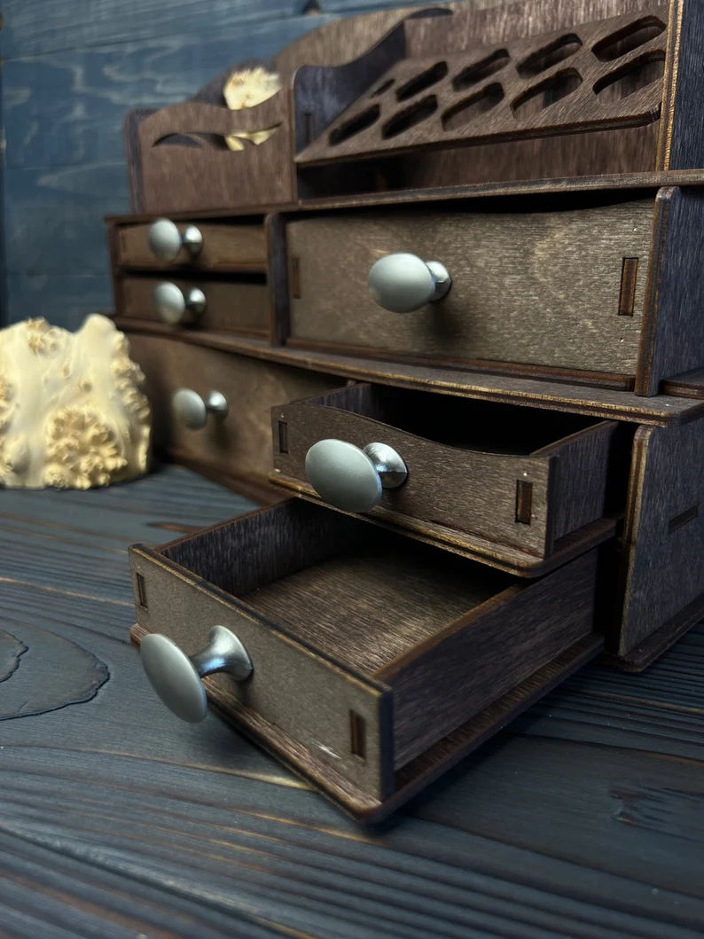 A side view of the organizer, showing its compact and spacious design, as well as the metal handles.