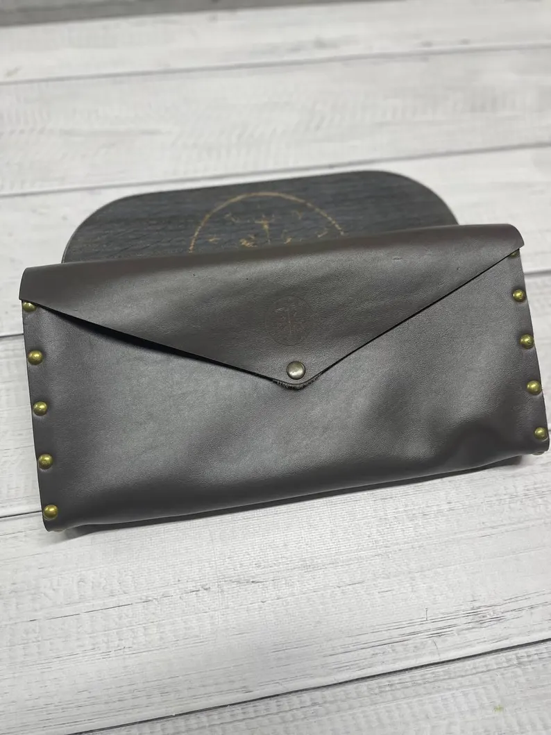 A top-down view of the sadhu board, showing the arrangement of the copper nails on the natural wood.