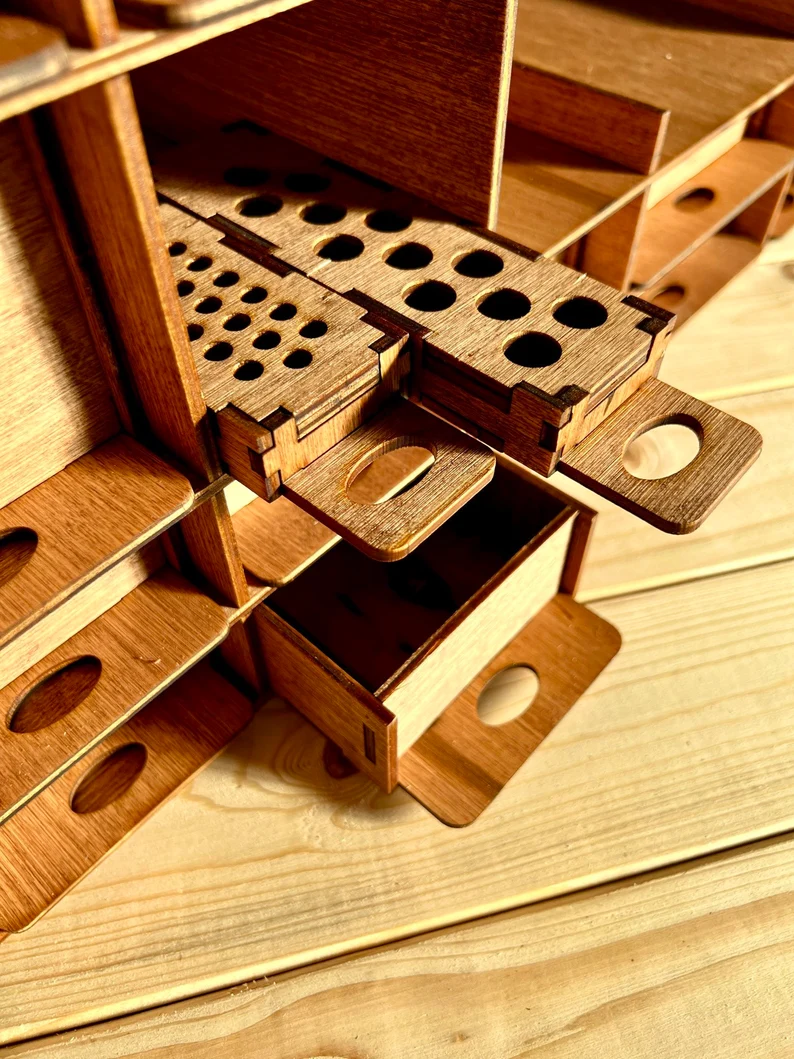 The organizer filled with a different set of supplies, such as calligraphy pens and small ink bottles.