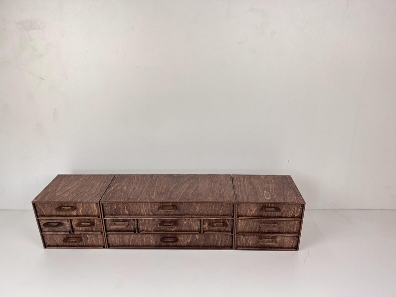 A photo showing the organizer from a different angle on a desk, next to a mirror or other beauty tools.