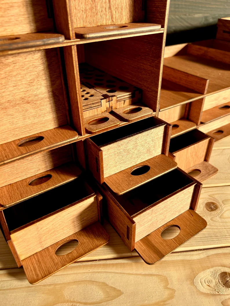 A photo of the organizer on a wooden desk, surrounded by other art-related items like a sketchbook and a cup of coffee, showcasing its use in a real-life setting.