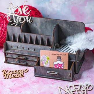 A top-down view of the "Origins" makeup organizer, showing the various compartments filled with different makeup products.