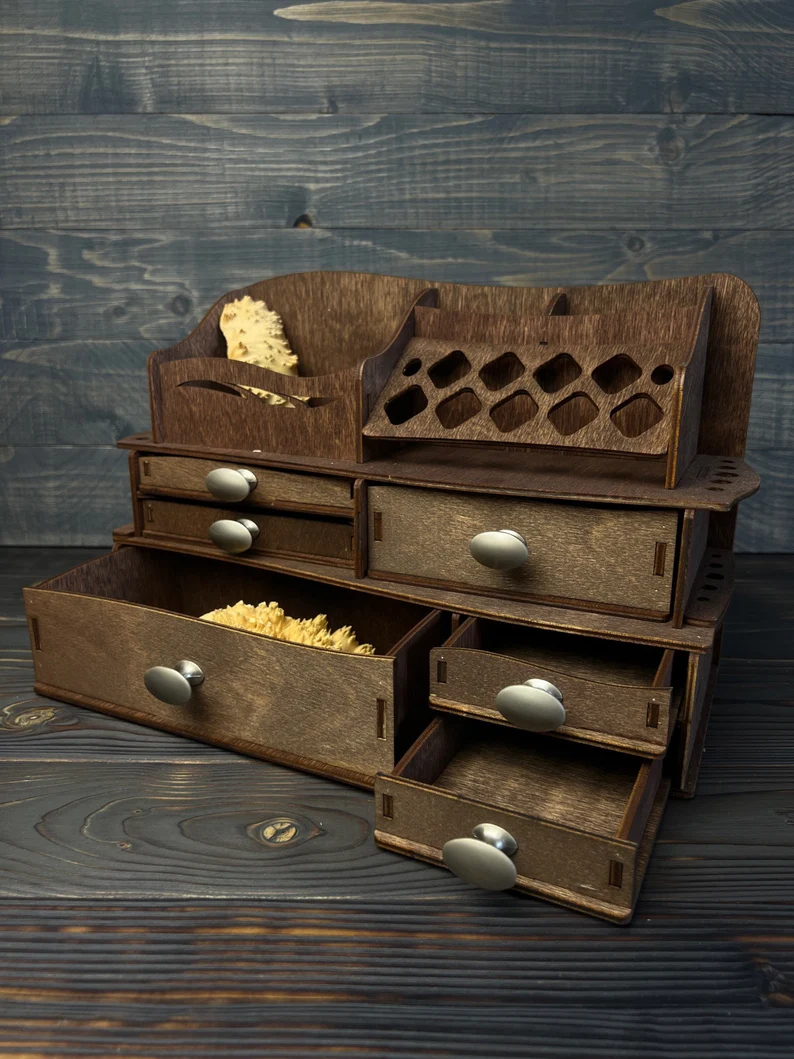 An image of the wooden "Siren" makeup organizer with metal pulls, filled with cosmetics.