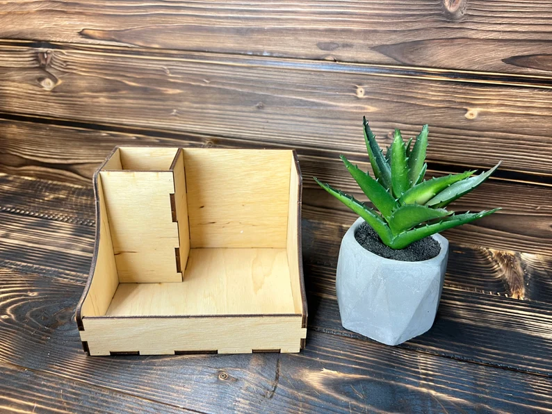 A top-down view of the modular makeup organizer showing the various compartments and their ability to be rearranged.