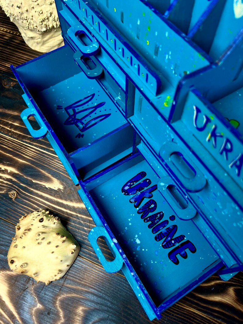 A lifestyle shot of the organizer on a vanity, with a card explaining the charity initiative.