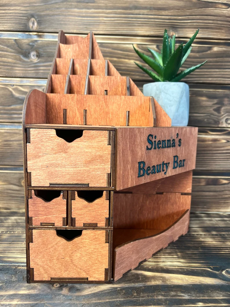 Close-up view of the "Cleopatra" organizer's drawers, filled with cosmetics.