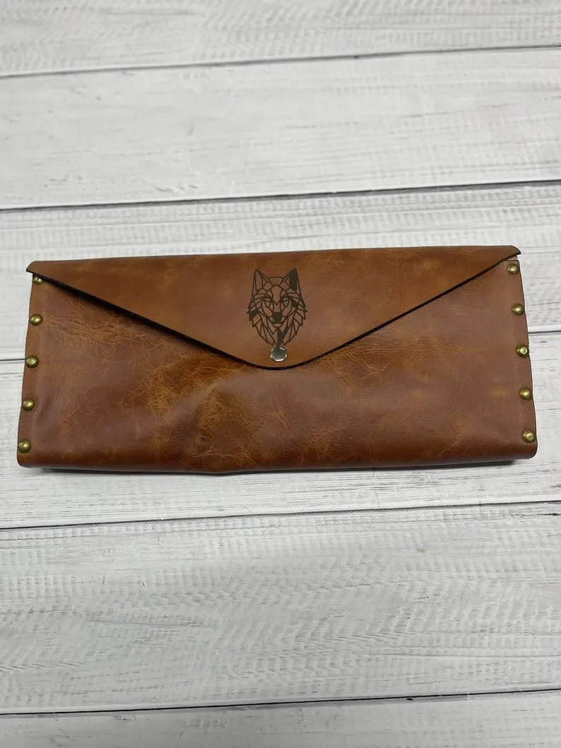 A side view of the board, highlighting the depth of the nails and the thickness of the wood.