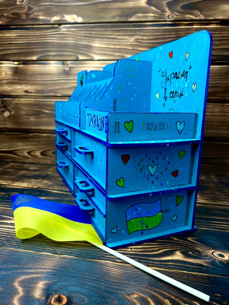 An image of a hand placing a donation coin next to the organizer to symbolize the charitable aspect.