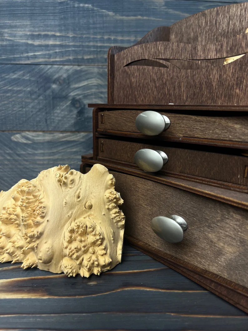 A close-up shot that shows the wood texture and the details of the metal handles.