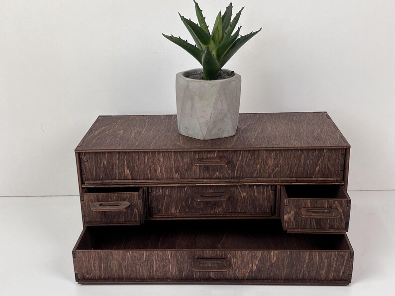 A flat lay image of the organizer with its compartments arranged in a different configuration.