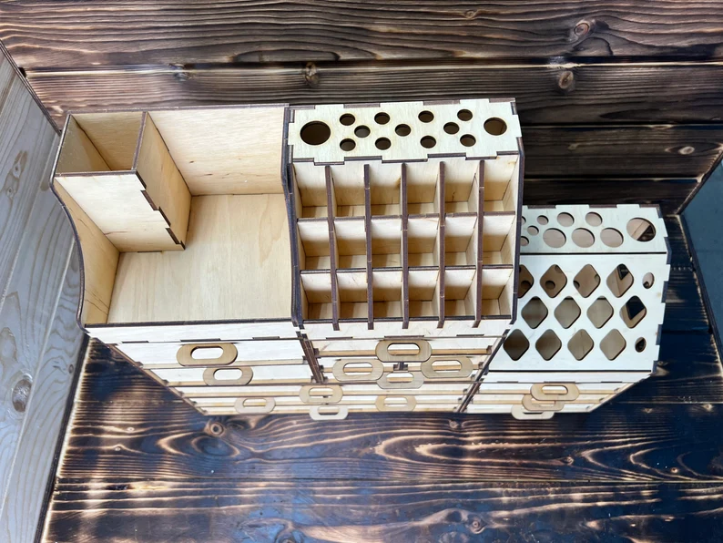 A close-up on a single compartment of the organizer, filled with lipstick and small beauty items.