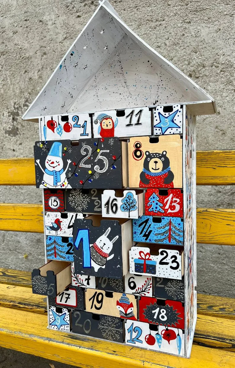 A shot of a hand placing a small candy or gift into one of the drawers.
