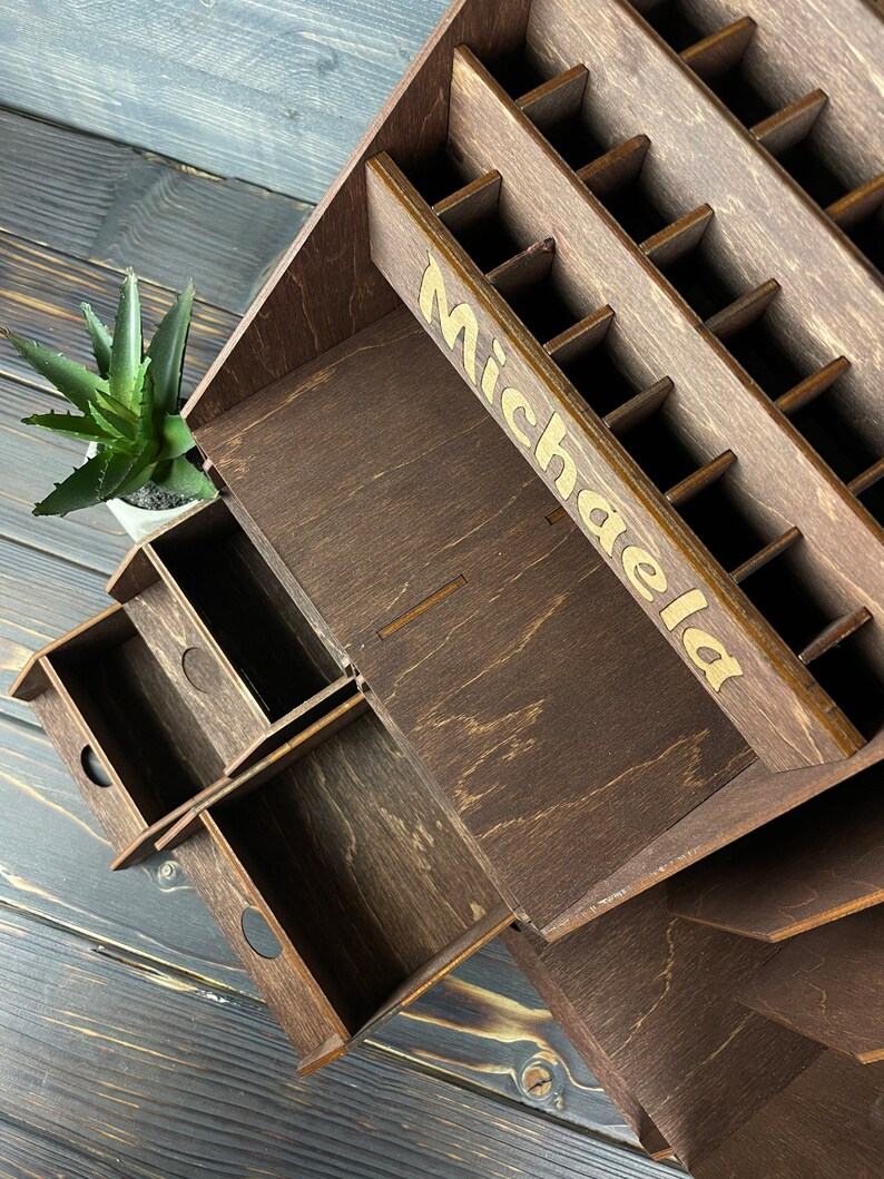A top-down view of the wooden makeup organizer, filled with various beauty products and brushes.