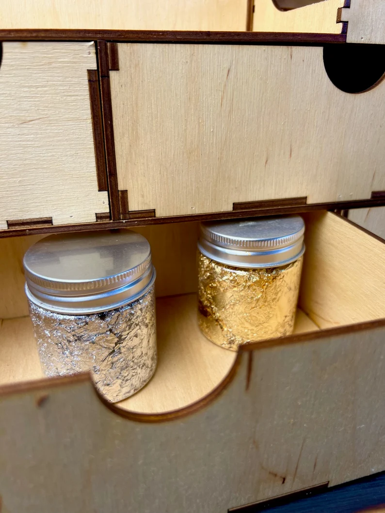 A top-down view of the organizer showing its numerous compartments filled with a variety of beauty products.