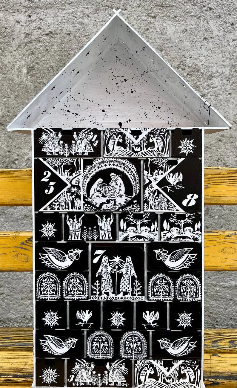 A close-up of the different compartments of the organizer, highlighting the smooth finish and clean lines of the wood.