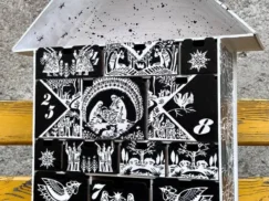 A close-up of a small decorative item placed in one of the compartments.