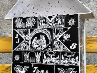 A close-up of a small decorative item placed in one of the compartments.