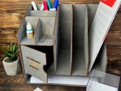 The magazine rack in a library setting, filled with books.