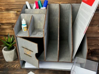 The magazine rack in a library setting, filled with books.