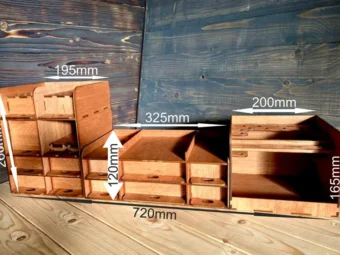 A close-up shot of a single compartment of the organizer, highlighting the fine wood grain and the smooth finish.